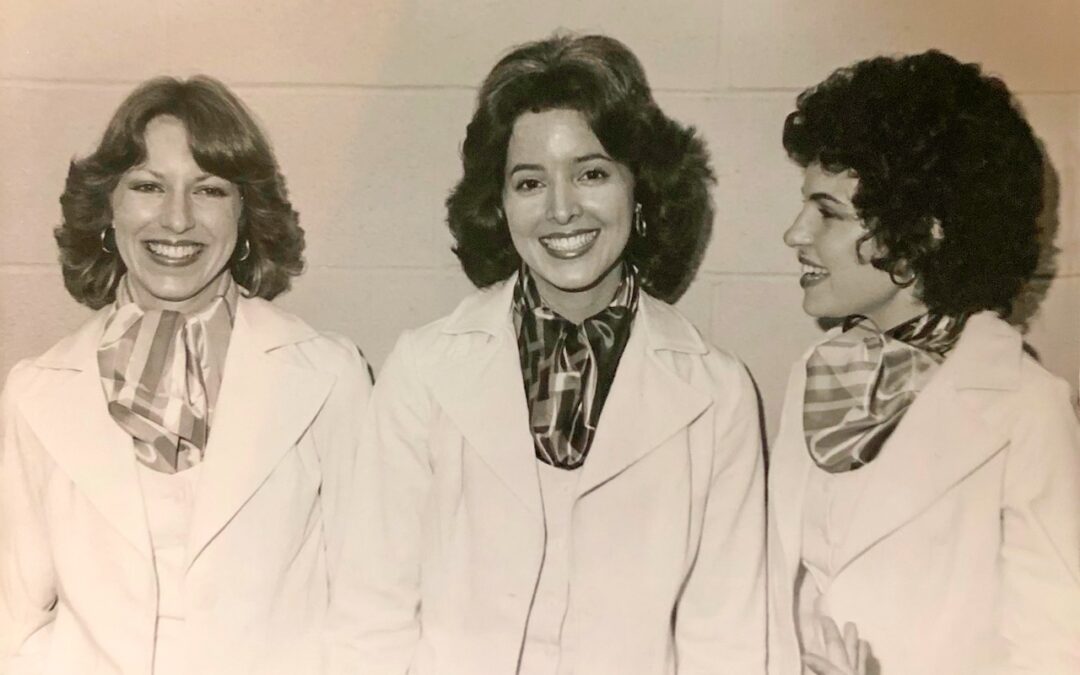 Photo of Cherry Sisters wearing matching white suits with scarves